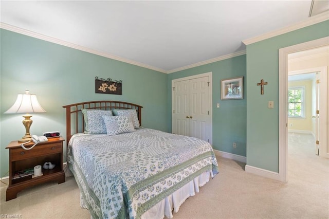bedroom with baseboards, carpet flooring, a closet, and ornamental molding