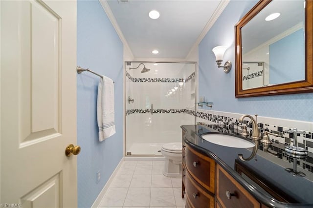 full bathroom with vanity, ornamental molding, toilet, and a shower stall
