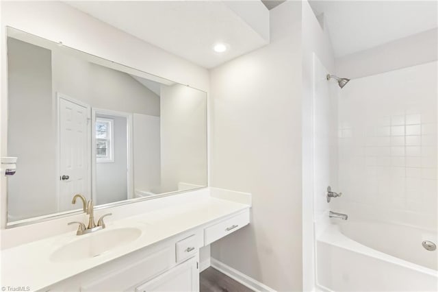 bathroom featuring vanity and shower / bathtub combination