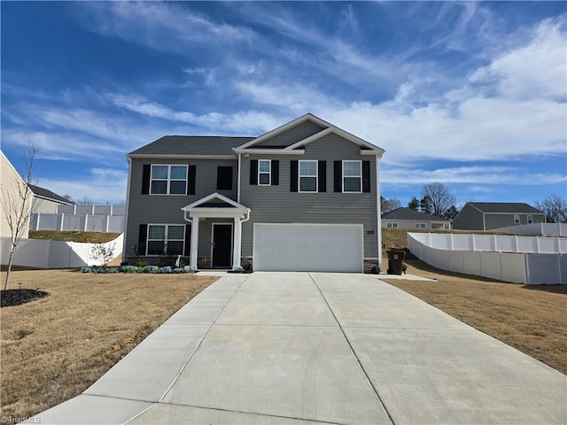 view of front of house with a garage, driveway, a front lawn, and fence