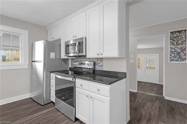 kitchen with white cabinets, stainless steel appliances, a wealth of natural light, and dark wood-type flooring