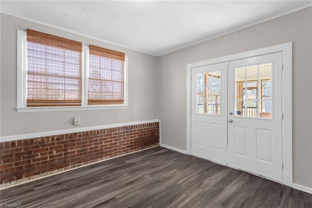 foyer featuring dark hardwood / wood-style flooring and ornamental molding