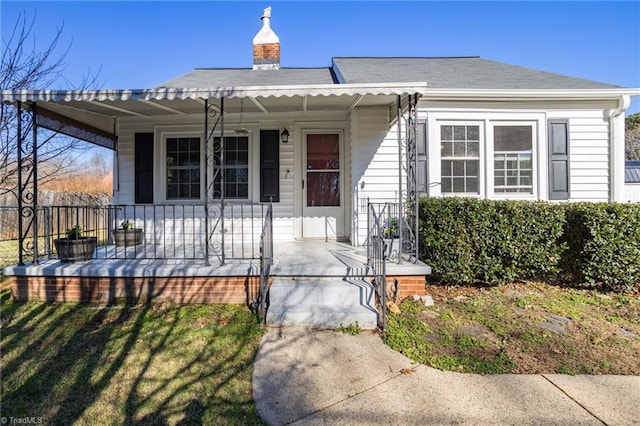 view of front of property featuring covered porch