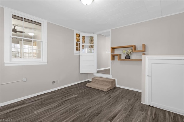 unfurnished living room with dark hardwood / wood-style flooring