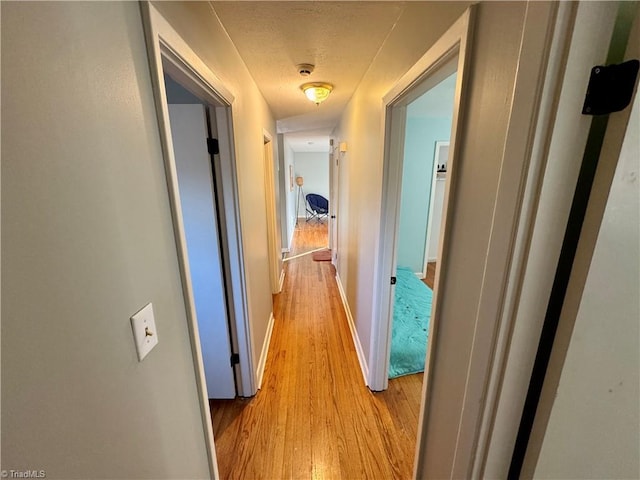 corridor featuring light wood-type flooring