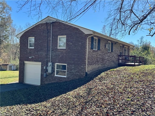 view of property exterior with a garage and a wooden deck