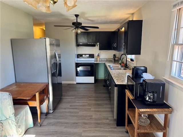 kitchen featuring hardwood / wood-style floors, white electric range, sink, ceiling fan, and stainless steel fridge