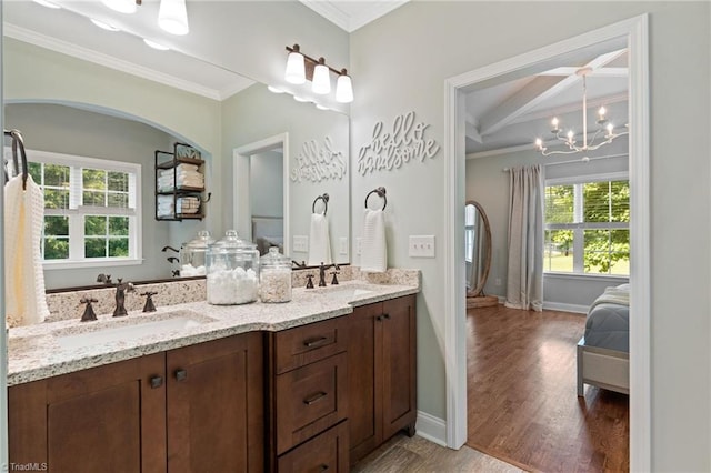 3922 Tam O Shanter Rd, Kernersville, NC 27284 - ensuite bathroom with crown molding, double vanity, wood finished floors, a chandelier, and beam ceiling