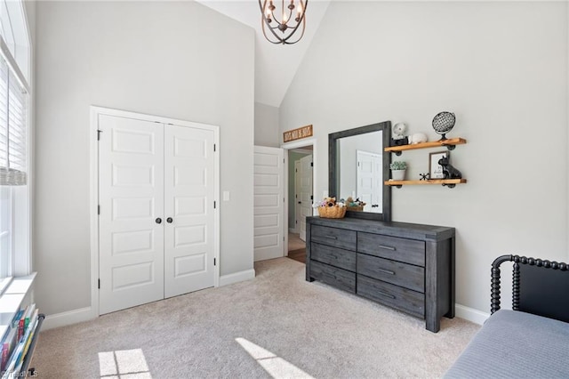 3922 Tam O Shanter Rd, Kernersville, NC 27284 - carpeted bedroom featuring high vaulted ceiling, a chandelier, and a closet
