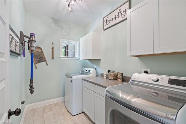 3922 Tam O Shanter Rd, Kernersville, NC 27284 - washroom with cabinet space and washing machine and clothes dryer
