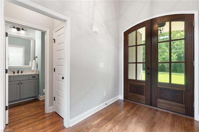 3922 Tam O Shanter Rd, Kernersville, NC 27284 - foyer featuring plenty of natural light, dark wood-style floors, french doors, and arched walkways