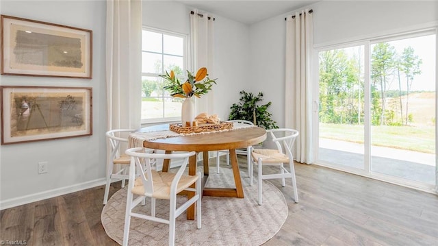 6617 Grogan Hill Rd, Whitsett, NC 27249 - dining room with wood finished floors and baseboards