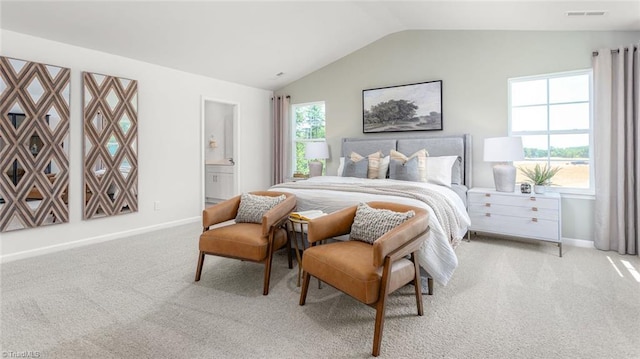 6617 Grogan Hill Rd, Whitsett, NC 27249 - bedroom with light colored carpet, vaulted ceiling, baseboards, and connected bathroom