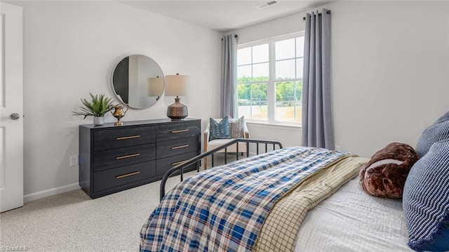 6617 Grogan Hill Rd, Whitsett, NC 27249 - bedroom featuring light carpet and baseboards