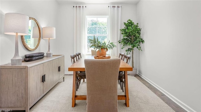 6617 Grogan Hill Rd, Whitsett, NC 27249 - dining space featuring baseboards and light wood-style flooring