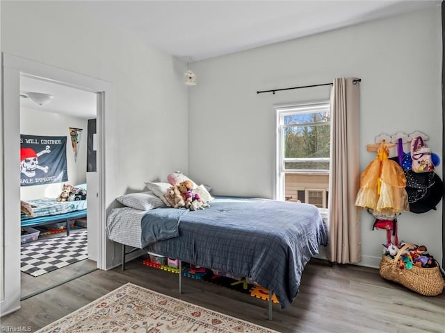 bedroom featuring wood-type flooring