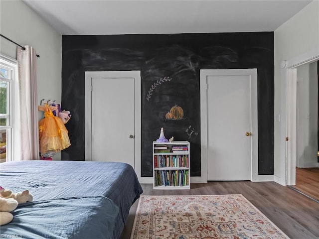 bedroom featuring wood-type flooring