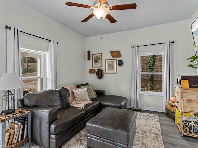 living room with hardwood / wood-style floors and ceiling fan