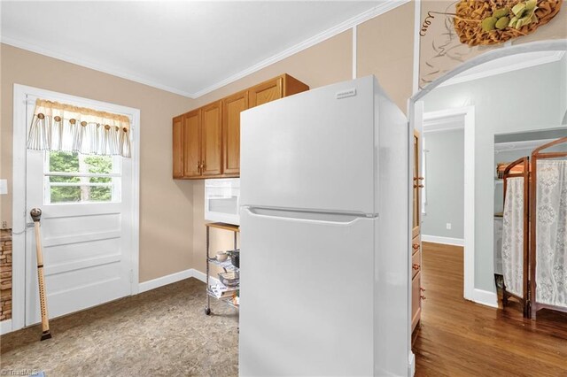 109 Easy St, Providence, NC 27315 - laundry area featuring crown molding, baseboards, and arched walkways
