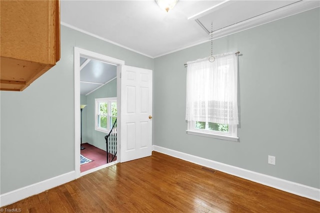 109 Easy St, Providence, NC 27315 - unfurnished room with attic access, wood finished floors, baseboards, ornamental molding, and lofted ceiling