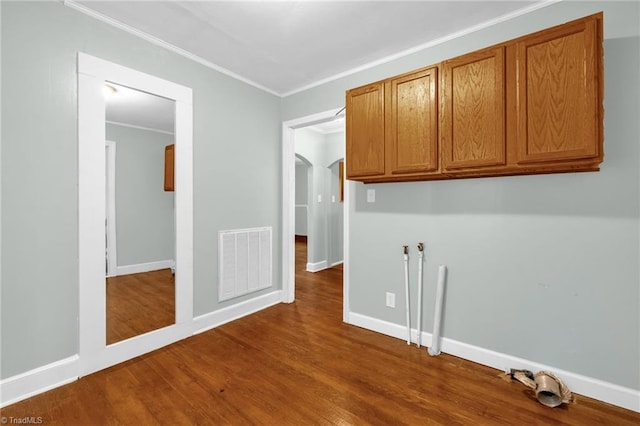 109 Easy St, Providence, NC 27315 - spare room featuring dark wood-style floors, ornamental molding, baseboards, and arched walkways