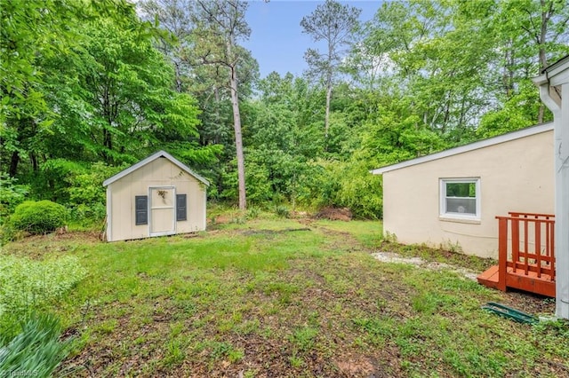 109 Easy St, Providence, NC 27315 - view of green lawn with a storage shed, an outbuilding, and a deck