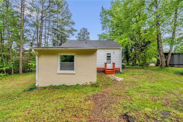 109 Easy St, Providence, NC 27315 - back of house featuring entry steps, a lawn, and stucco siding