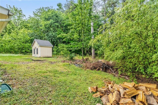 109 Easy St, Providence, NC 27315 - view of yard featuring an outbuilding and a storage shed