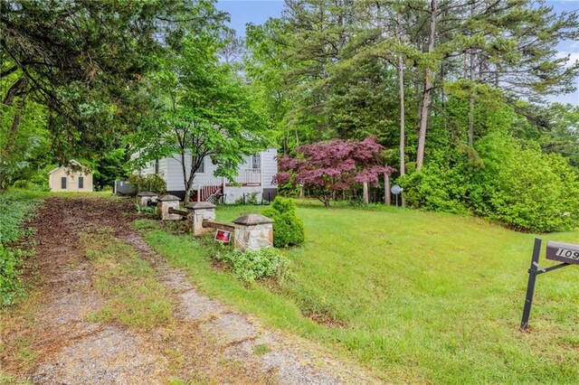 109 Easy St, Providence, NC 27315 - view of green lawn with driveway