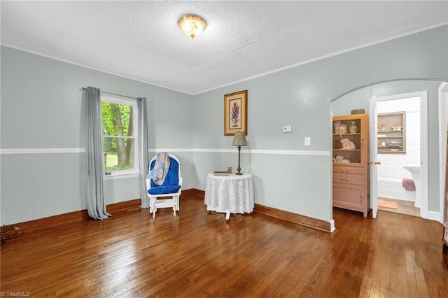 109 Easy St, Providence, NC 27315 - bedroom with wood-type flooring, arched walkways, a textured ceiling, ornamental molding, and baseboards