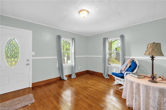 109 Easy St, Providence, NC 27315 - entrance foyer featuring healthy amount of natural light, hardwood / wood-style flooring, a textured ceiling, and baseboards