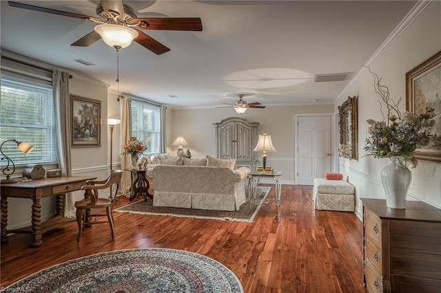 living room featuring crown molding, dark wood-type flooring, and ceiling fan