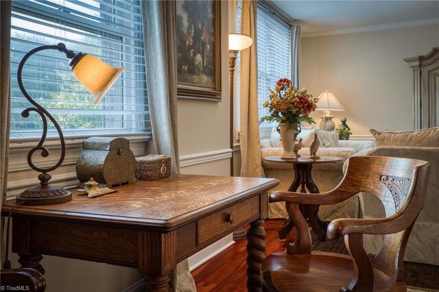 sitting room featuring ornamental molding and dark hardwood / wood-style flooring