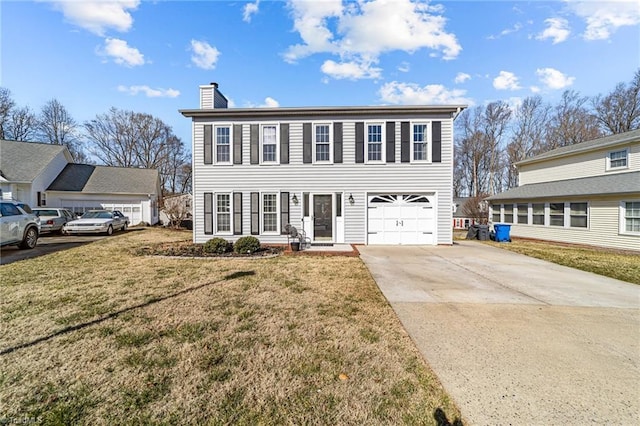 view of front of home featuring a garage and a front lawn