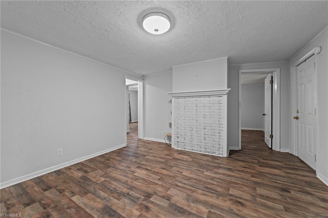 interior space with dark hardwood / wood-style floors and a textured ceiling