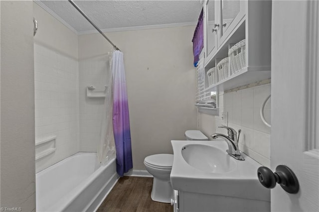 full bathroom featuring hardwood / wood-style flooring, vanity, toilet, crown molding, and a textured ceiling