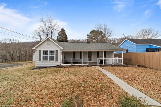 ranch-style house with a porch and a front yard