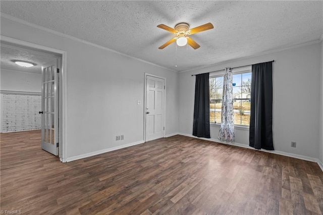 unfurnished room featuring dark wood-type flooring, ceiling fan, and crown molding