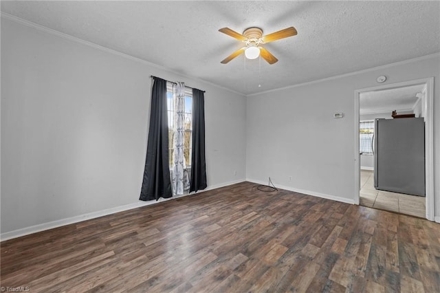 unfurnished room featuring hardwood / wood-style flooring, crown molding, ceiling fan, and a textured ceiling