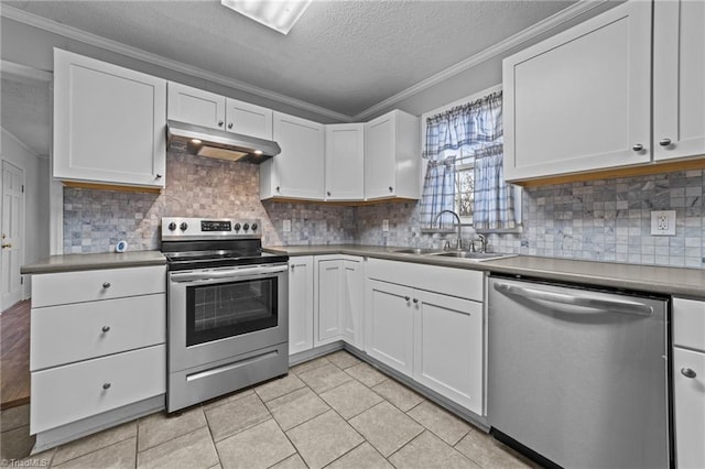 kitchen featuring sink, ornamental molding, white cabinets, and appliances with stainless steel finishes