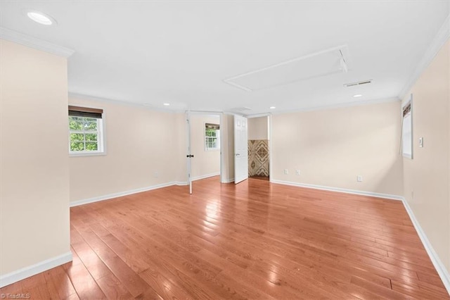 649 W Main St, Franklinville, NC 27248 - empty room with attic access, ornamental molding, light wood-style floors, and baseboards