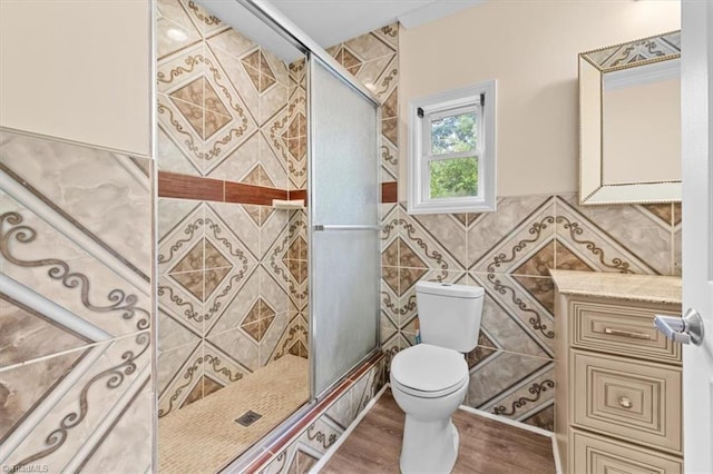 649 W Main St, Franklinville, NC 27248 - full bath with toilet, a stall shower, tile walls, wood finished floors, and vanity