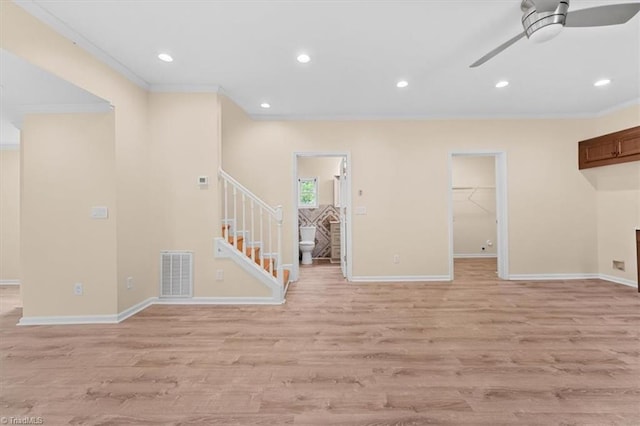 649 W Main St, Franklinville, NC 27248 - unfurnished living room featuring ornamental molding, ceiling fan, stairs, baseboards, and light wood finished floors