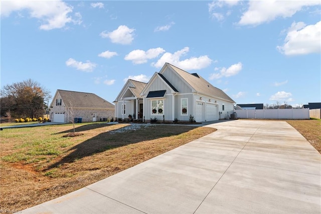 view of front of home with a front lawn and a garage