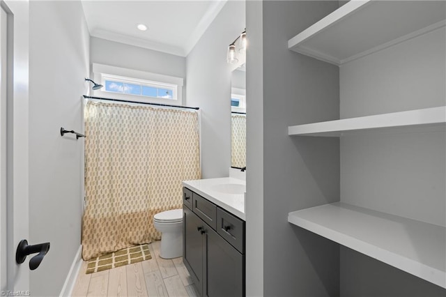 full bathroom featuring vanity, shower / washtub combination, hardwood / wood-style flooring, toilet, and ornamental molding