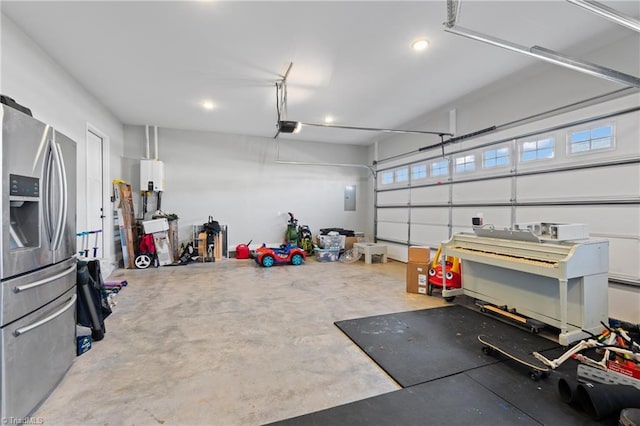 garage featuring electric panel, stainless steel fridge, and a garage door opener