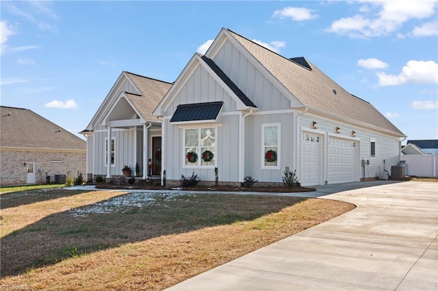 view of front of property with a garage and a front lawn