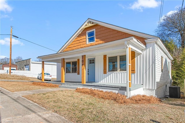 view of front of property with covered porch and central AC unit