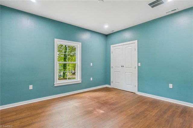 1924 E 25th St, Winston-Salem, NC 27105 - empty room featuring baseboards, wood finished floors, and recessed lighting