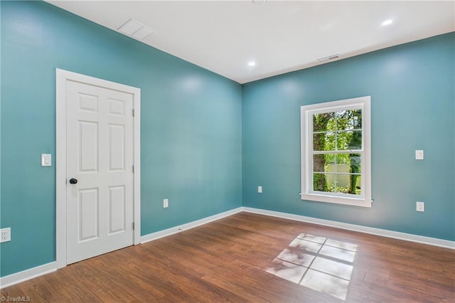 1924 E 25th St, Winston-Salem, NC 27105 - unfurnished room with wood finished floors, baseboards, and recessed lighting